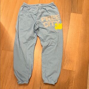 freecity Pale Blue Sweatpants with Yellow Logo